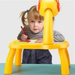 Table with light and with music inside | Mini Art Drawing Board Leds Projector Light Toy Children Kids Painting Table Small Desk(Random Color) - Image 2