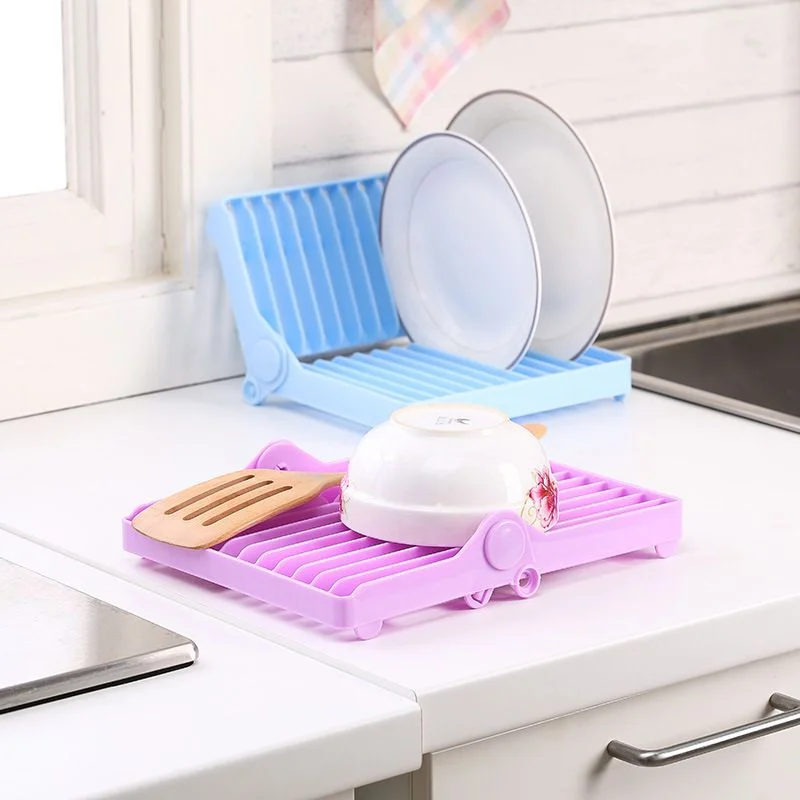 125-3vkvbviictjnums7zupod3ibb4pc25pdadewz9gx.webp Small Kitchen Foldable Dish Plate Drying Rack | Multipurpose Space Saving Storage Organizer Plastic Rack (Random color) - Image 1