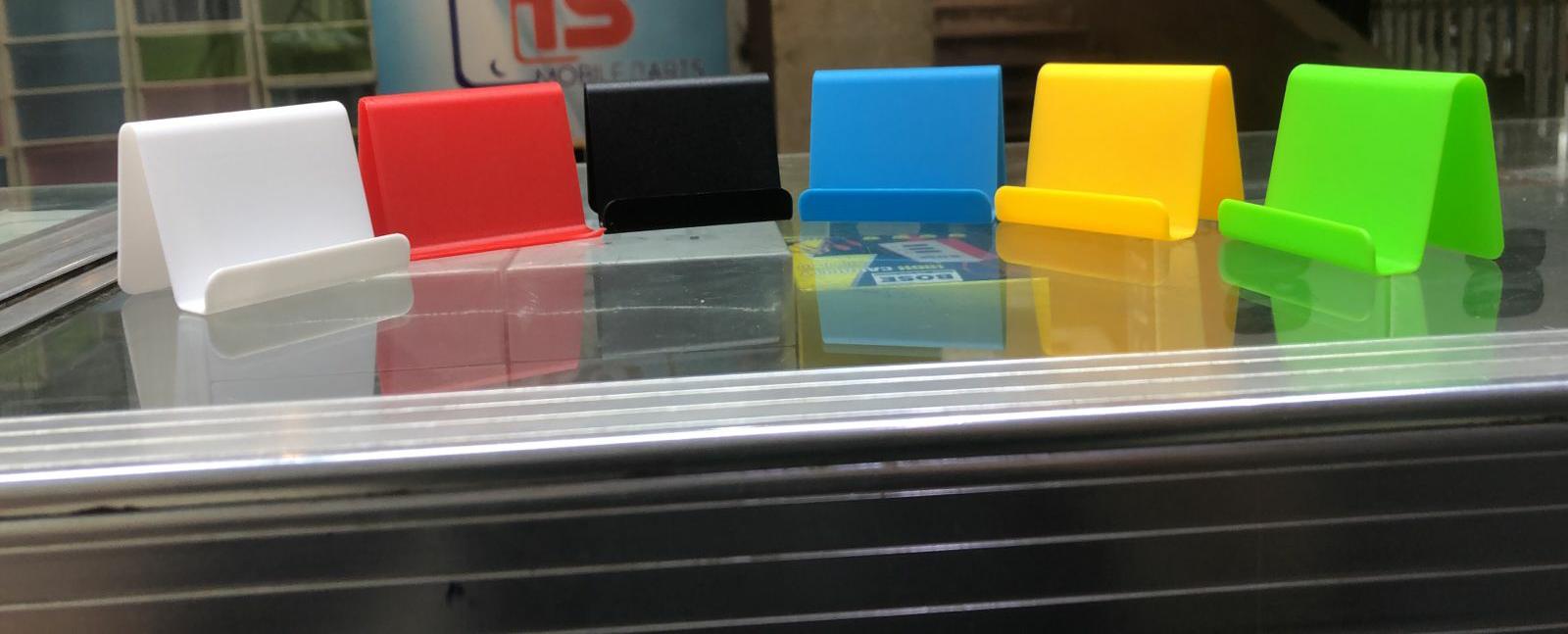 WhatsApp-Image-2023-12-13-at-8.30.53-PM.jpeg 1Pc Cell Phone Stand For Desk (Random Colour) - Image 1